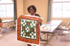 Nellie-new-member-with-her-beginners-class-quilt